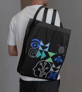 A custom black tote bag for IBM TechXchange. 