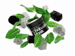A product shot of Prettyboy Charcoal Mask surrounded by an explosion of its ingredients. 