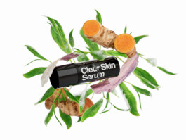A product shot of Prettyboy Clear Skin Serum, surrounded by an explosion of its ingredients. 